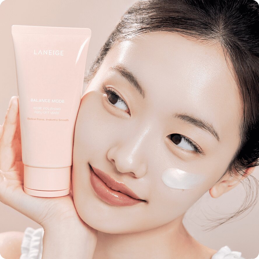 Woman applying LANEIGE Balance Mode Polishing Peel-Off Mask to her cheek
