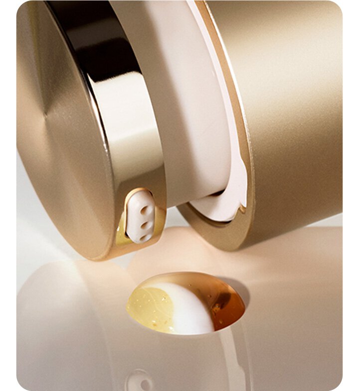 Close-up of Perfect Renew 3X Signature Serum Advanced pump dispensing three-layer formula.