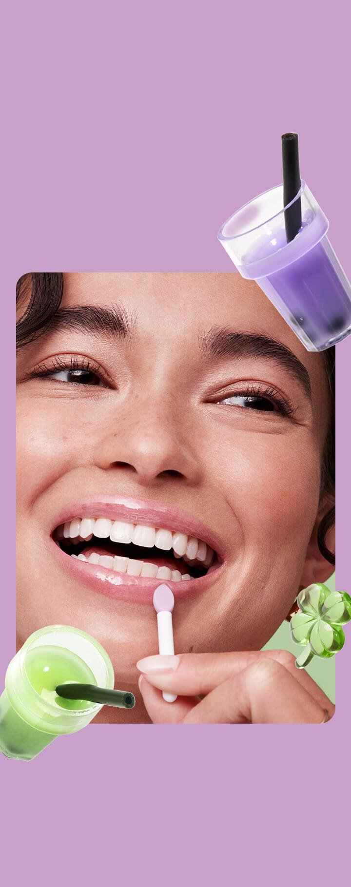 A smiling model applying purple Laneige Lip & Eye Sleeping Mask with playful smoothie graphics, highlighting its fruity, fun concept.