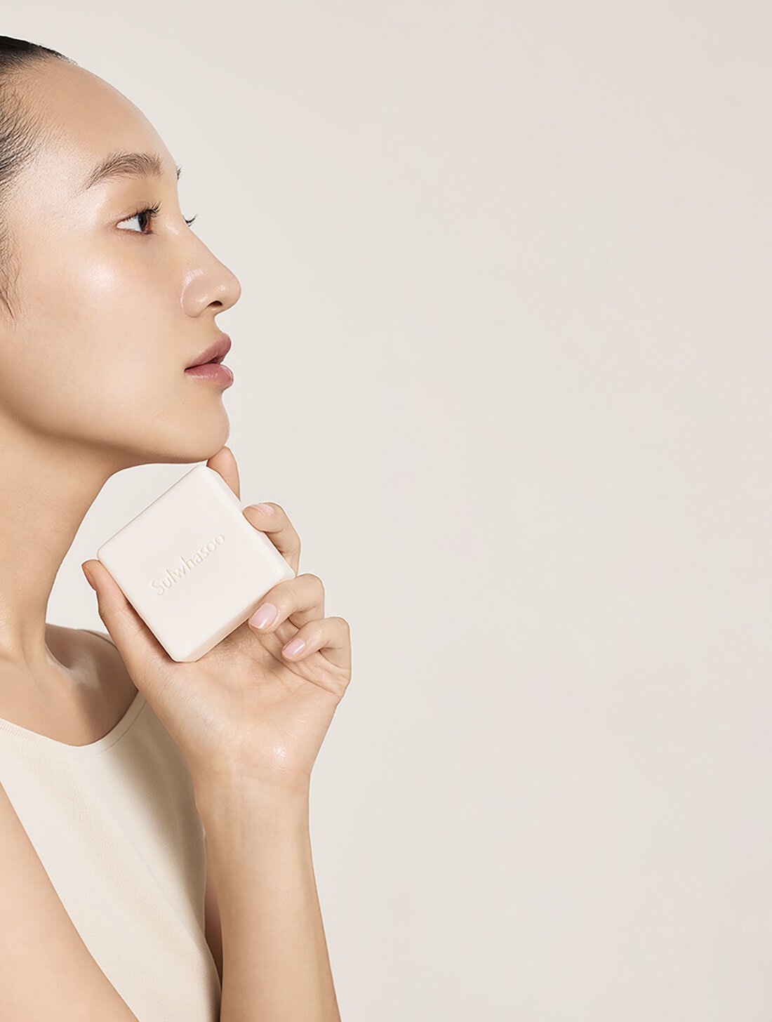 Model with Signature Ginseng Facial Soap in hand