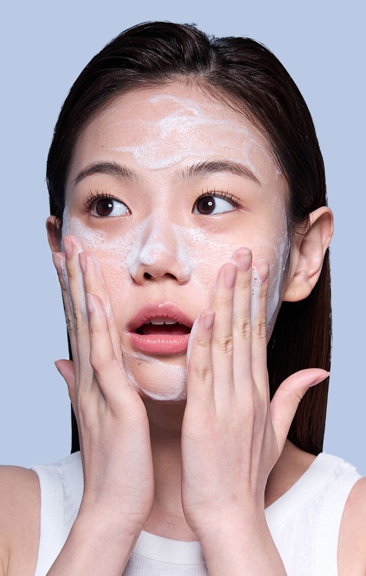 A model is washing her face using the Laneige Water Bank Gentle Gel Cleanser
