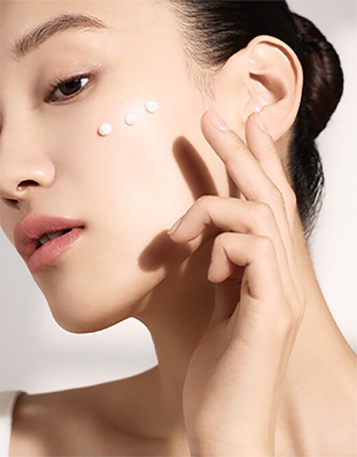 Model to demonstrate UV Daily Essential Sunscreen on the face