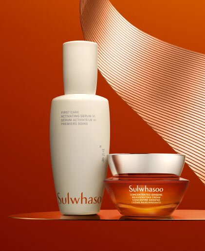 A bottle of Sulwhasoo First Care Activating Serum sits beside a jar of Sulwhasoo Concentrated Ginseng Rejuvenating Cream, both products showcasing their luxurious textures and promising deeply hydrating and wrinkle-softening benefits.