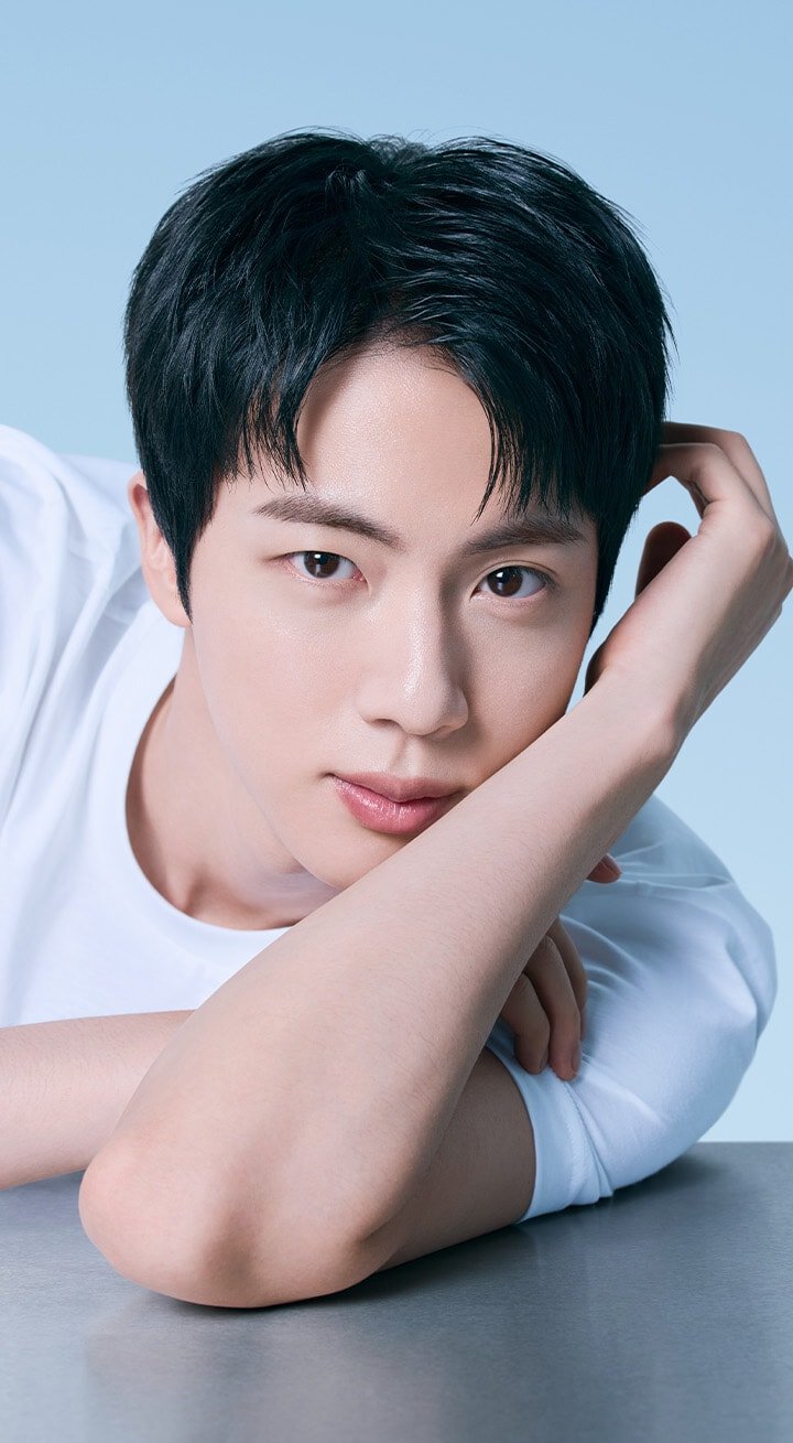 Close-up of a BTS Jin with clear and radiant skin, showcasing the benefits of Cream Skin Zincpep™ Toner & Gel Moisturizer