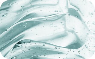 A close-up reveals the smooth, translucent texture of Laneige's Cica Sleeping Mask, showcasing its gel-like consistency and tiny air bubbles, highlighting its hydrating and soothing properties.