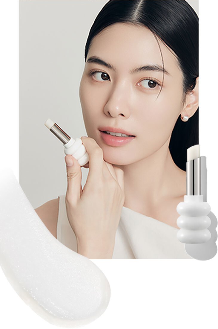 A model with Glowing Lip Balm  NO. 000 Clear on her lips