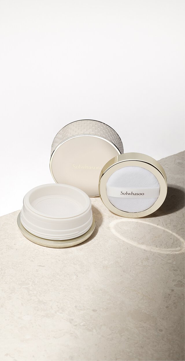 The elegant gold-toned Sulwhasoo Perfecting Powder compact is displayed open with its mesh sifter and branded puff, representing a skin-caring finish powder that sets makeup perfectly in place.